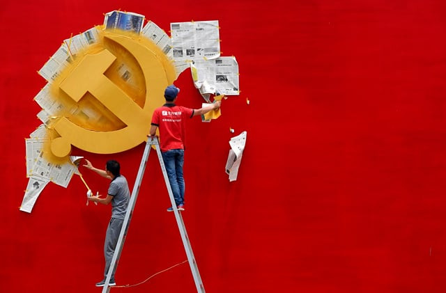 workers peel papers off a wall as they re paint the chinese communist party flag at the nanhu revolution memorial museum in jiaxing photo reuters workers peel papers off a wall as they re paint the chinese communist party flag at the nanhu revolution memorial museum in jiaxing photo reuters