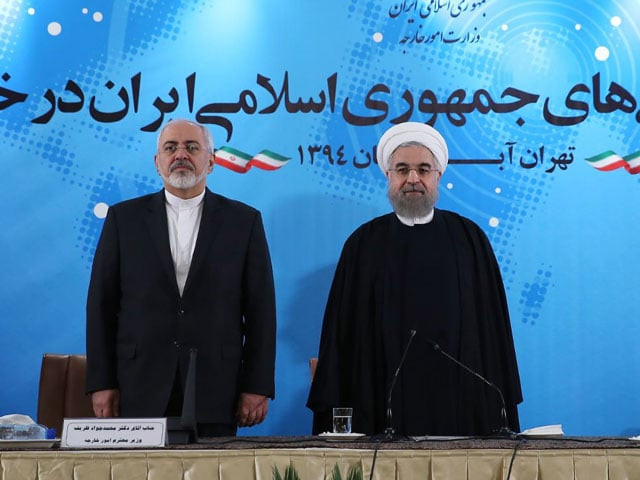 a handout photo provided by the office of iranian president hassan rouhani r shows standing next to his foreign minister mohammad javad zarif l while they listen iran 039 s national anthem during a meeting with foreign ambassadors and other top diplomats in tehran on november 2 2015 photo afp a handout photo provided by the office of iranian president hassan rouhani r shows standing next to his foreign minister mohammad javad zarif l while they listen iran 039 s national anthem during a meeting with foreign ambassadors and other top diplomats in tehran on november 2 2015 photo afp
