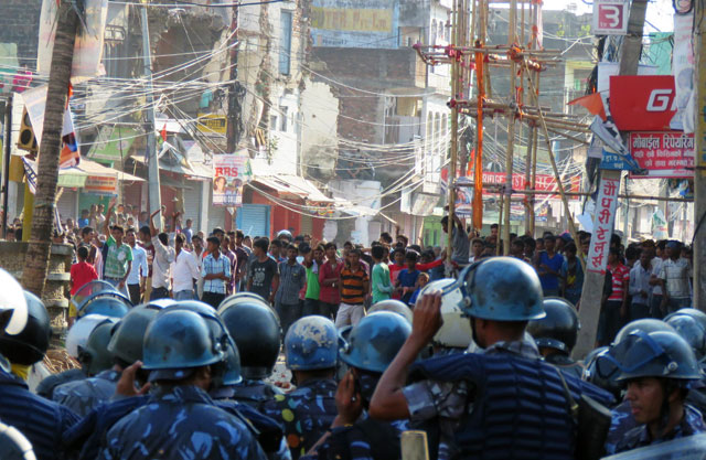 nepalese police face off with protesters during clashes near the nepal india border at birgunj some 90 km south of kathmandu on november 2 2015 photo afp