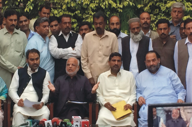 ejaz chaudhry political adviser to pakistan tehreek i insaf chief imran khan addressing a press conference photo express