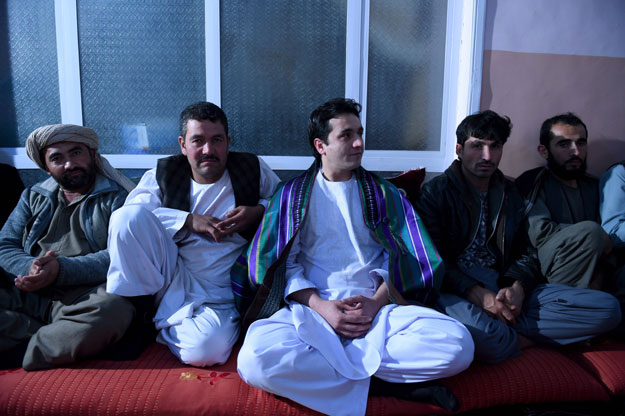 in this photograph taken on october 18 2015 an afghan groom c looks on during his wedding celebrations at khoja paytakht in maimana the capital of the northern province of faryab photo afp