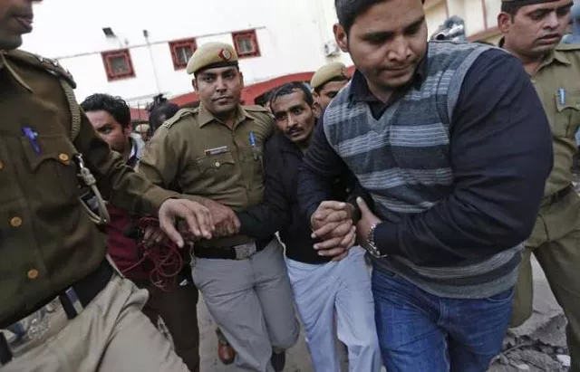 policemen escort driver shiv kumar yadav 3rd r in black jacket who is accused of a rape outside a court in new delhi december 8 2014 photo reuters policemen escort driver shiv kumar yadav 3rd r in black jacket who is accused of a rape outside a court in new delhi december 8 2014 photo reuters