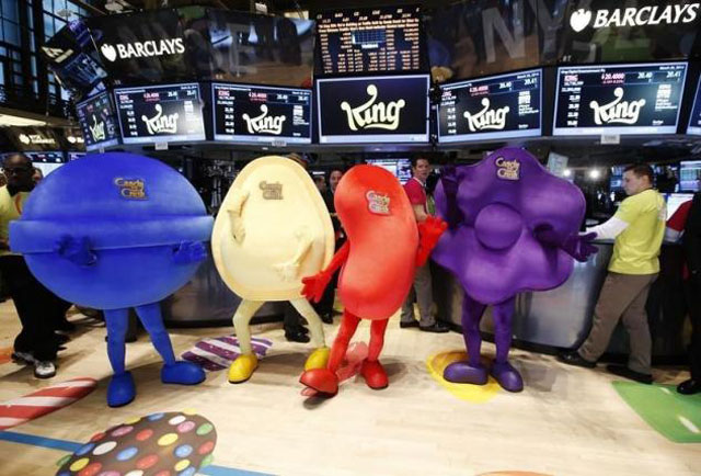 mascots dressed as characters from the mobile video game 039 candy crush saga 039 pose during the ipo of mobile game maker king digital entertainment plc on the floor of the new york stock exchange march 26 2014 photo reuters