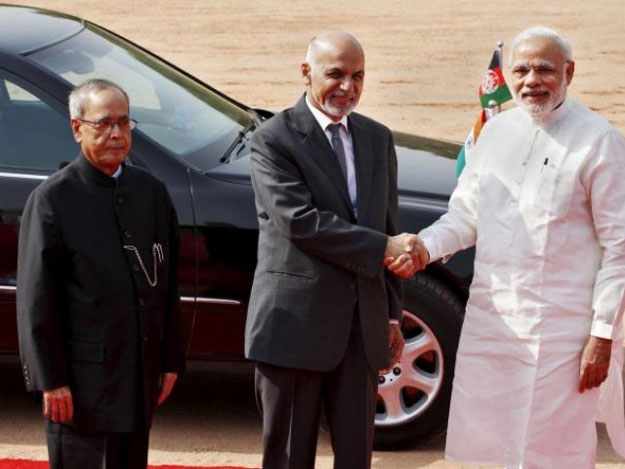 afghanistan 039 s president ashraf ghani c shakes hands with india 039 s prime minister narendra modi r as his indian counterpart pranab mukherjee looks on upon ghani 039 s arrival to attend a ceremonial reception at the forecourt of india 039 s presidential palace photo reuters