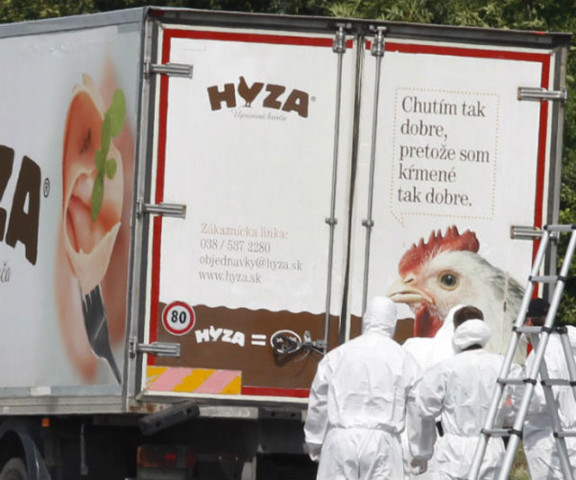 austrian forensics experts outside the hungarian licensed truck where the bodies of 71 migrants were found photo afp austrian forensics experts outside the hungarian licensed truck where the bodies of 71 migrants were found photo afp