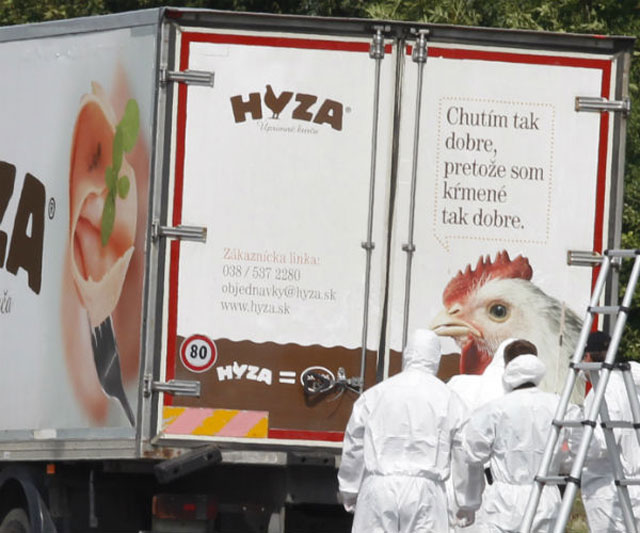 austrian forensics experts outside the hungarian licensed truck where the bodies of 71 migrants were found photo afp