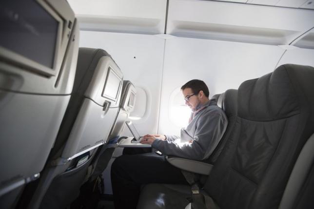 a man uses his laptop to test a new high speed inflight internet service named fli fi while on a special jetblue media flight out of john f kennedy international airport in new york photo reuters