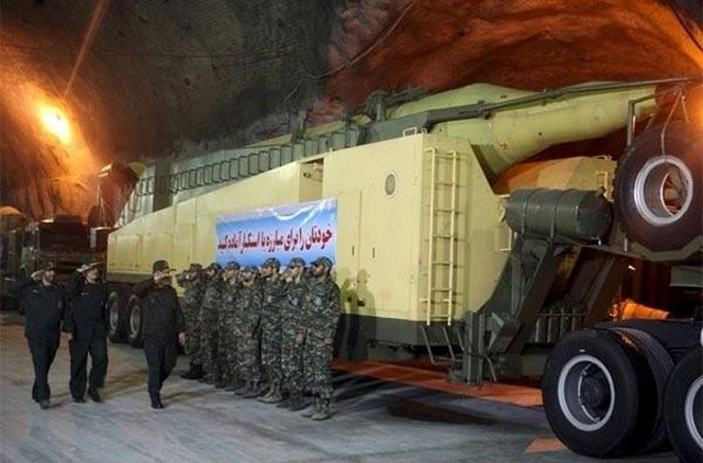 members of iran 039 s islamic revolutionary guard corps irgc aerospace force salute at an underground missile base with launcher units in an undisclosed location in this undated handout photo courtesy of fars news photo reuters