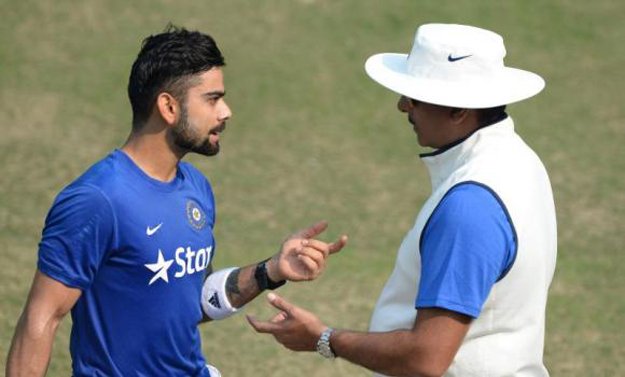 india 039 s virat kohli left talks with team director ravi shastri during a training session on the eve of the first test match against south africa at the punjab cricket association stadium in mohali on wednesday photo afp