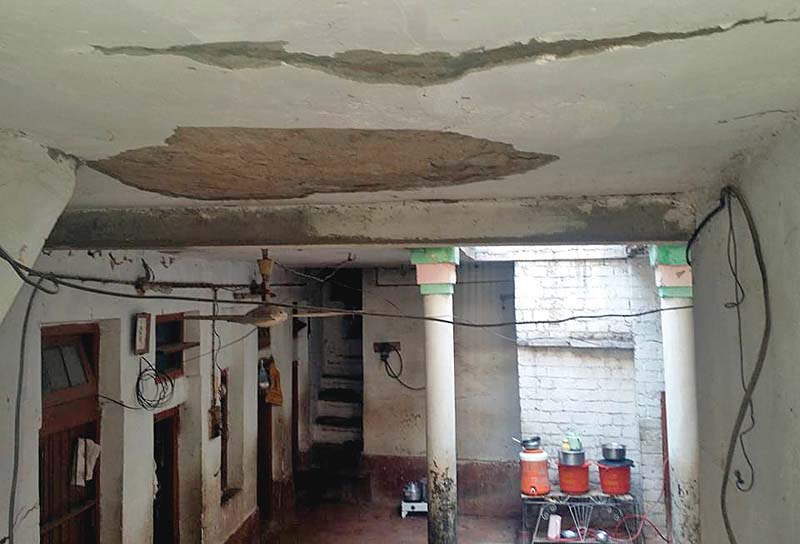 a house shows visible cracks on the ceiling photo express