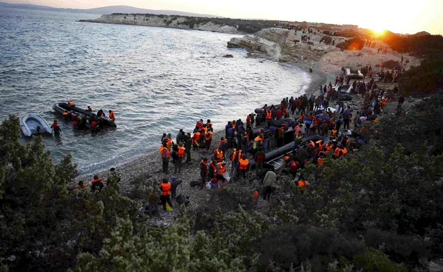 refugees gather at a beach to try to sail off for the greek island of chios from the western turkish coastal town of cesme in izmir province turkey on november 4 2015 photo reuters refugees gather at a beach to try to sail off for the greek island of chios from the western turkish coastal town of cesme in izmir province turkey on november 4 2015 photo reuters