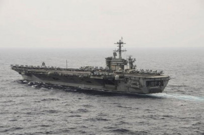 pentagon chief visits us carrier in disputed south china sea blames beijing for tension