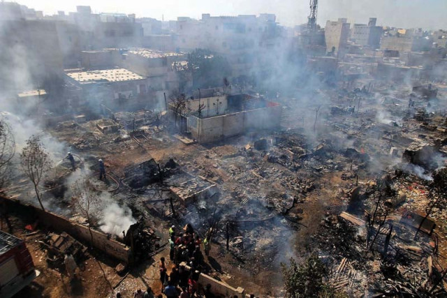 a fire erupted in a shanty town in mehmoodabad destroying at least 100 makeshift huts photo athar khan express a fire erupted in a shanty town in mehmoodabad destroying at least 100 makeshift huts photo athar khan express
