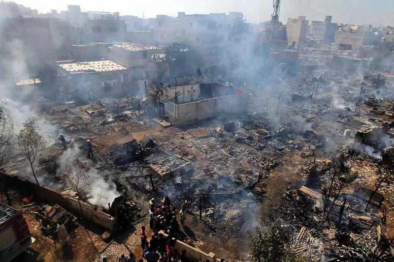 a fire erupted in a shanty town in mehmoodabad destroying at least 100 makeshift huts photo athar khan express a fire erupted in a shanty town in mehmoodabad destroying at least 100 makeshift huts photo athar khan express