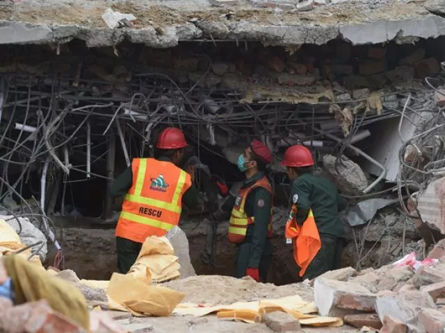 rubble of just top two storeys removed death toll jumps to 23 photo express rubble of just top two storeys removed death toll jumps to 23 photo express