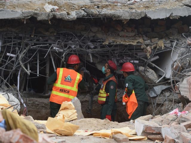 rubble of just top two storeys removed photo express