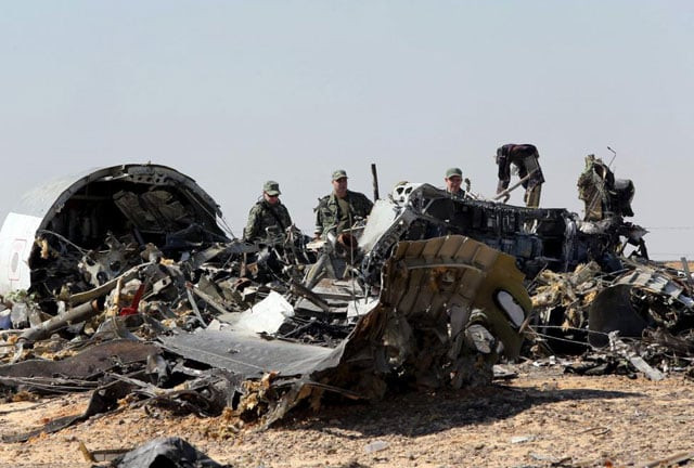 military investigators from russia stand near the debris of a russian airliner at the site of its crash at the hassana area in arish city north egypt november 1 2015 photo reuters military investigators from russia stand near the debris of a russian airliner at the site of its crash at the hassana area in arish city north egypt november 1 2015 photo reuters