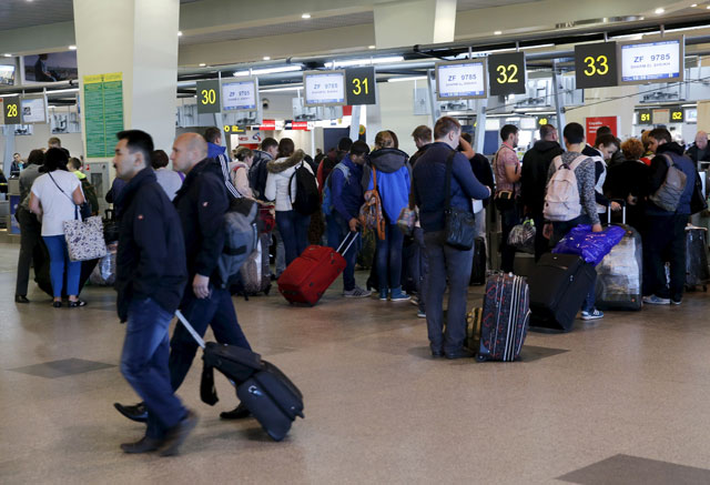 passengers stand in a line to get registered for the flight zf 9785 of azur air from domodedovo airport to sharm al sheikh outside moscow russia november 6 2015 photo reuters