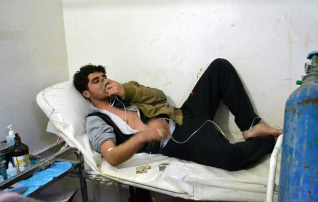 a syrian is given oxygen after a chemical weapon attack in idlib province on march 17 2015 photo afp a syrian is given oxygen after a chemical weapon attack in idlib province on march 17 2015 photo afp