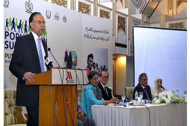 federal minister for planning and development ahsan iqbal addressing during population summit 2015 photo app