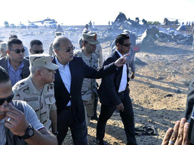 the egyptian prime minister sherif ismail gestures as he examine the wreckage at the site of the russian plane crash sinai egypt oct 31 2015 photo epa