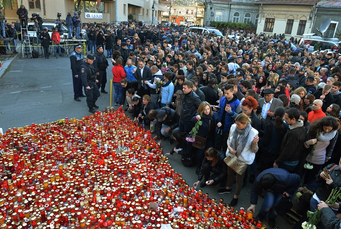 candles are layed down in the memory of victims two days after a fire accident at the colectivu club in bucharest november 1 2015 photo afp