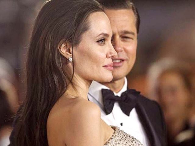 Angelina Jolie and her husband Brad Pitt pose at the premiere of By the Sea at AFI Festival 2015 on November 5. PHOTO: REUTERS