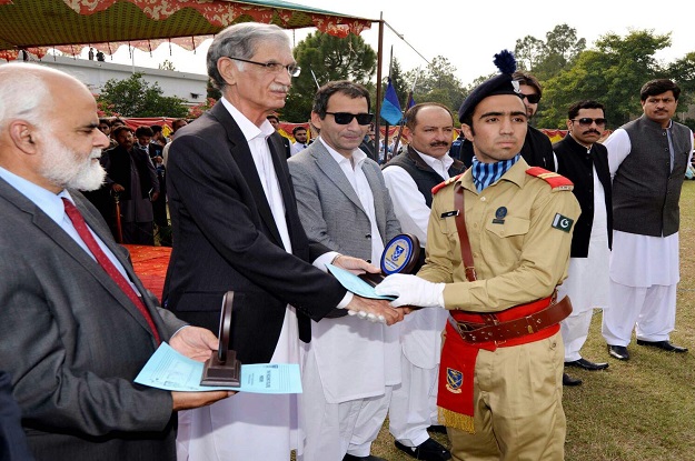 cm distributing prizes for position holding students on the occasion photo express