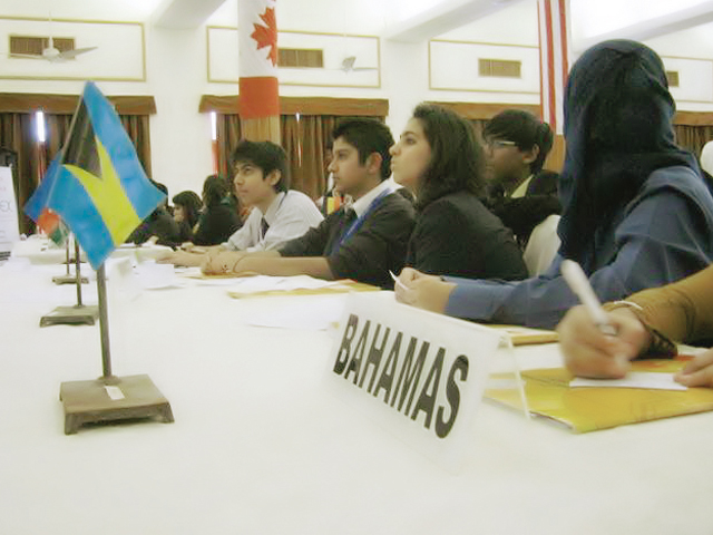 delegates sit through their third committee session on sunday anxiously waiting for the day to end so the awards could be announced photo express saher baloch