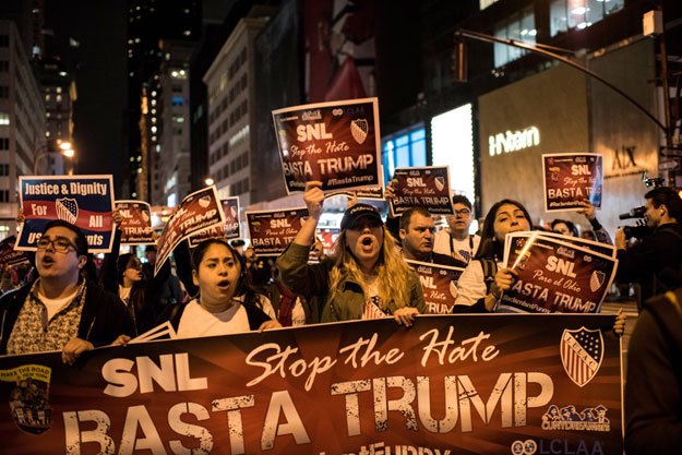 members of latino organizations march from the trump tower to nbc studios during a rally against republican presidential candidate donald trump on november 7 2015 in new york city photo afp