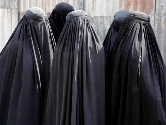 locals alerted police after noticing that a burqa clad 039 woman 039 talking on the phone was wearing men 039 s shoes photo reuters file