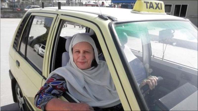 zahida kazmi waits for customers in her taxi photo file