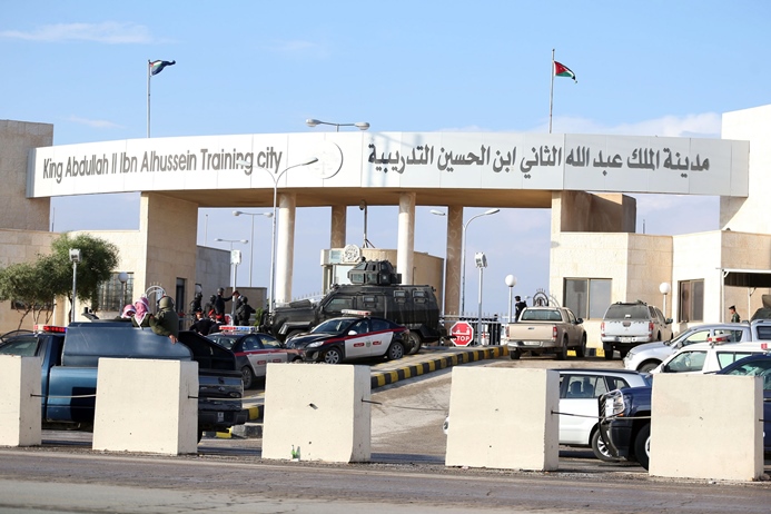 police officers and security forces stand guard outside a police training centre east of amman on november 9 2015 photo afp