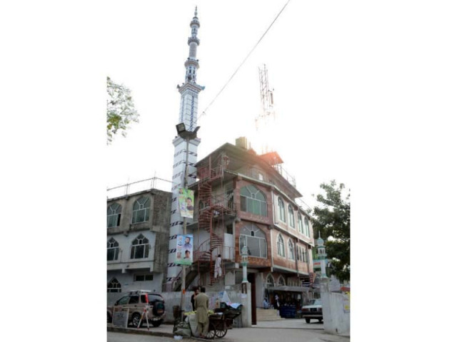 a view of the mosque built on encroached land merchandise stacked outside a shop a restaurant set up outside a bakery photos huma choudhary express