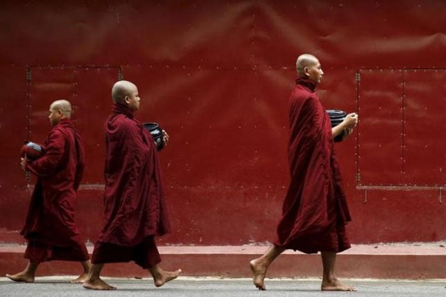 buddhist monks walk inside the masoyein monastery complex in mandalay october 7 2015 photo reuters