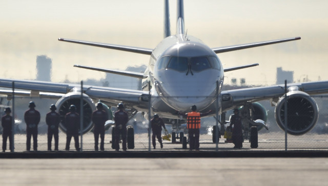 ground staff prepare to see off japan 039 s first domestically produced passenger jet the mitsubishi regional jet mrj prior to its maiden test flight at nagoya airport aichi prefecture on november 11 2015 japan 039 s first domestic passenger jet successfully took off on its maiden test flight november 11 culminating a decade of development for a programme aimed at competing with brazilian and canadian rivals in the global market for smaller aircraft photo afp ground staff prepare to see off japan 039 s first domestically produced passenger jet the mitsubishi regional jet mrj prior to its maiden test flight at nagoya airport aichi prefecture on november 11 2015 japan 039 s first domestic passenger jet successfully took off on its maiden test flight november 11 culminating a decade of development for a programme aimed at competing with brazilian and canadian rivals in the global market for smaller aircraft photo afp