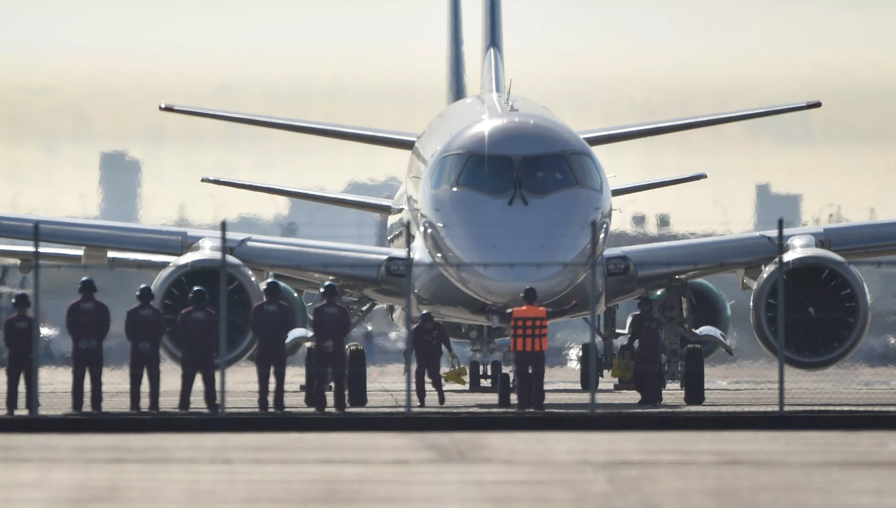 ground staff prepare to see off japan 039 s first domestically produced passenger jet the mitsubishi regional jet mrj prior to its maiden test flight at nagoya airport aichi prefecture on november 11 2015 japan 039 s first domestic passenger jet successfully took off on its maiden test flight november 11 culminating a decade of development for a programme aimed at competing with brazilian and canadian rivals in the global market for smaller aircraft photo afp ground staff prepare to see off japan 039 s first domestically produced passenger jet the mitsubishi regional jet mrj prior to its maiden test flight at nagoya airport aichi prefecture on november 11 2015 japan 039 s first domestic passenger jet successfully took off on its maiden test flight november 11 culminating a decade of development for a programme aimed at competing with brazilian and canadian rivals in the global market for smaller aircraft photo afp