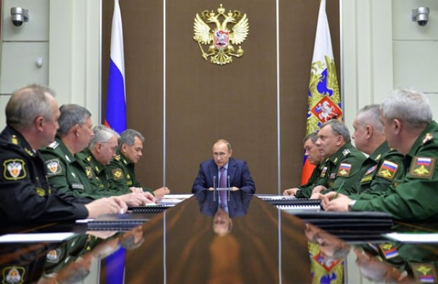 putin c chairs a meeting on the national defense sector in sochi on november 10 2015 photo afp putin c chairs a meeting on the national defense sector in sochi on november 10 2015 photo afp