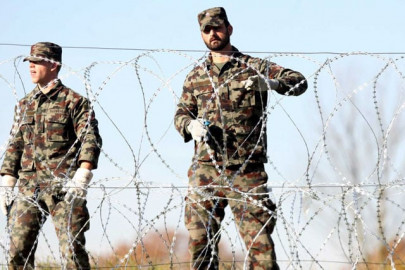 slovenian army unrolling razor wire on croatia border slovenian army unrolling razor wire on croatia border
