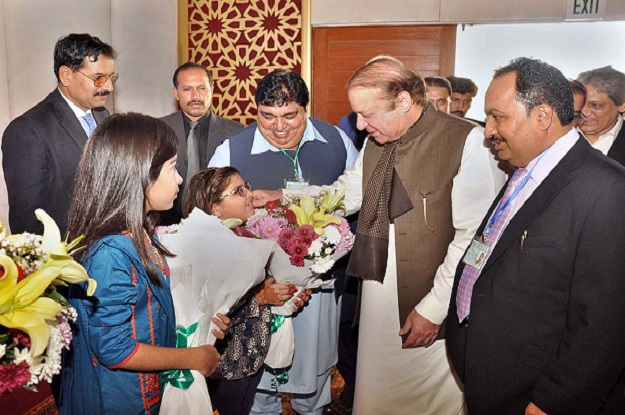 prime minister nawaz sharif being presented bouquet on his arrival at diwali function photo app