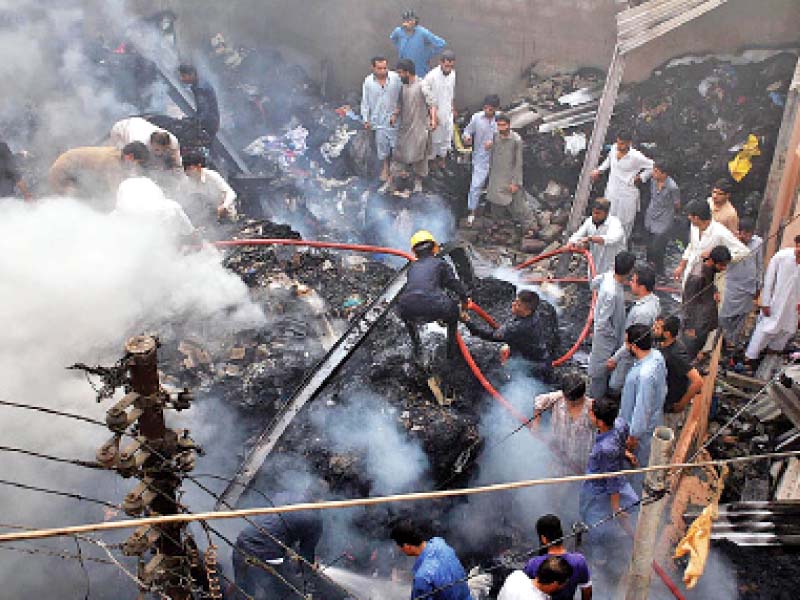 firefighters work to put out a fire that broke out in a clothes godown at landa bazaar no one was injured during the fire photo online