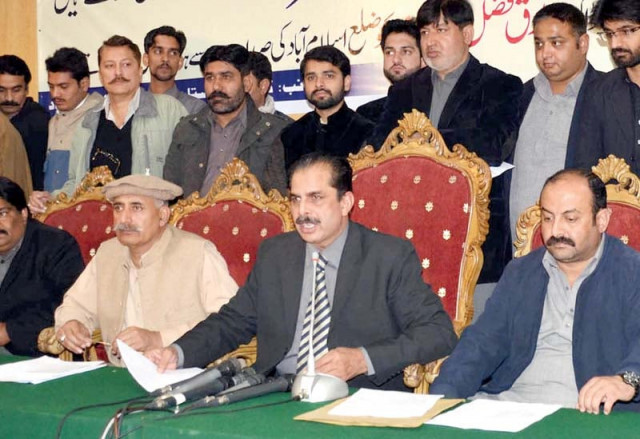 pml n leader ashraf gujjar speaks at a press conference banners hang outside an election office a motorcyclist passes by a pti candidate s election banner photos mudassar raja waseem nazir express pml n leader ashraf gujjar speaks at a press conference banners hang outside an election office a motorcyclist passes by a pti candidate s election banner photos mudassar raja waseem nazir express
