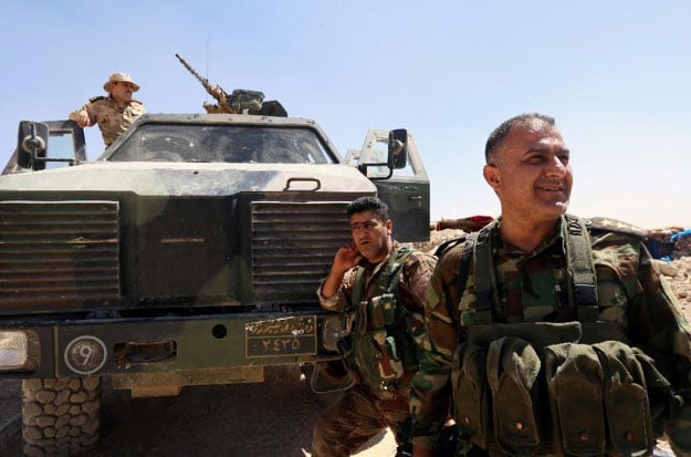 file picture shows iraqi kurdish peshmerga fighters on the frontline against islamic state is group militants near the northern iraqi town of sinjar photo afp