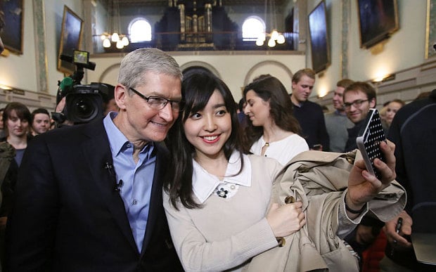 apple chief executive tim cook left poses for selfies with students at trinity college in dublin photo the telegraph