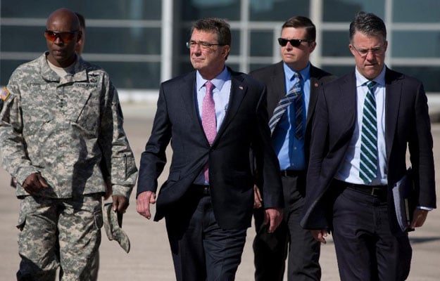 file picture shows us defence secretary ashton carter c with chief of staff eric rosenbach r and lieutenant general ron lewis l at queen alia airport in amman photo afp