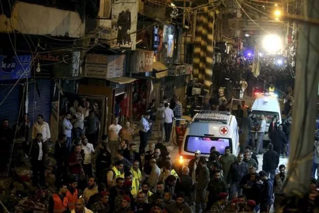 red cross vehicles drive by as residents and lebanese army members inspect a damaged area caused by two explosions in beirut 039 s southern suburbs lebanon november 12 2015 photo reuters red cross vehicles drive by as residents and lebanese army members inspect a damaged area caused by two explosions in beirut 039 s southern suburbs lebanon november 12 2015 photo reuters