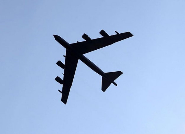 the us has flown close to disputed islands in the south china sea claimed by beijing in the latest confrontation over the fate of the spratly islands photo afp the us has flown close to disputed islands in the south china sea claimed by beijing in the latest confrontation over the fate of the spratly islands photo afp