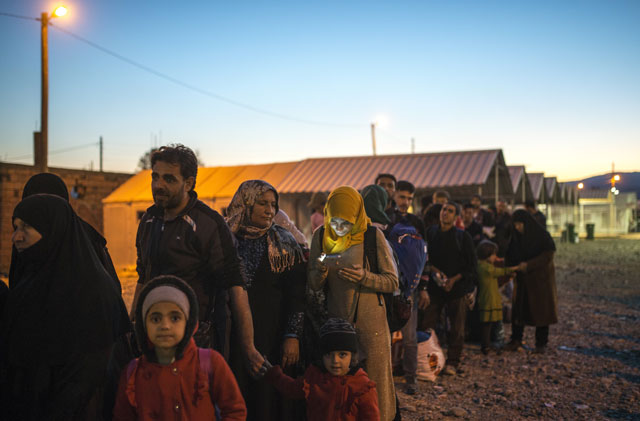 migrants and refugees wait for a train heading to serbia from the greek macedonian border near gevgelija on november 12 2015 photo afp