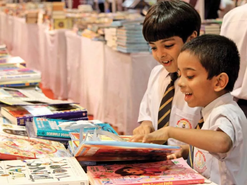 children check out books at a stall at karachi s expo centre on friday the five day book fair ends on monday photo aysha saleem express children check out books at a stall at karachi s expo centre on friday the five day book fair ends on monday photo aysha saleem express