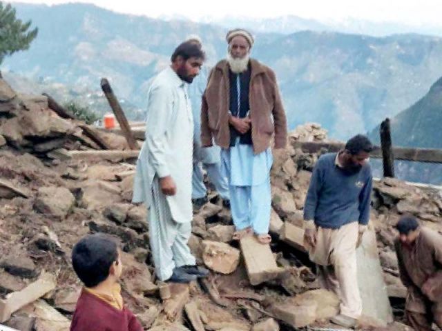 earthquake survivors busy reconstructing destroyed buildings photo inp